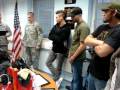 UFC fighters receive an award from the military